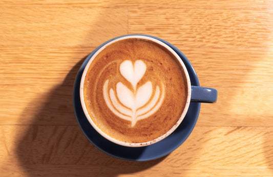 Latte art in a blue cup at Americano Cafe